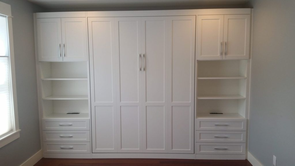 Guest bedroom makeover, custom Murphy bed installed, vertical, wall to wall, small spaces, custom cabinetry. SmartSpaces.com