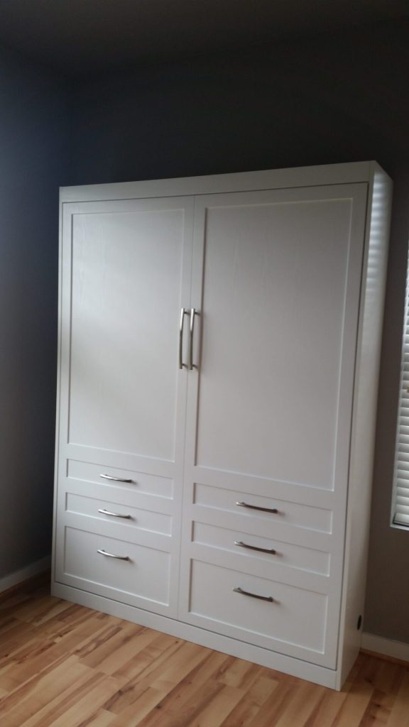 Guest bedroom makeover, custom Murphy bed installed, vertical, wall to wall, small spaces, custom cabinetry. SmartSpaces.com